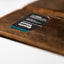 The inside front cover shows a business card in the holder