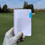 Holding up the second page of a filled-out golf log