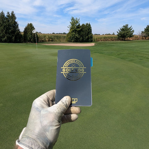 Holding up the pocket golf log.