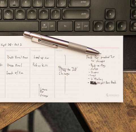 Filled out weekly planner sheet with Monday through Friday columns and notes section