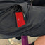 Red card with a logo sticking out of a black shorts